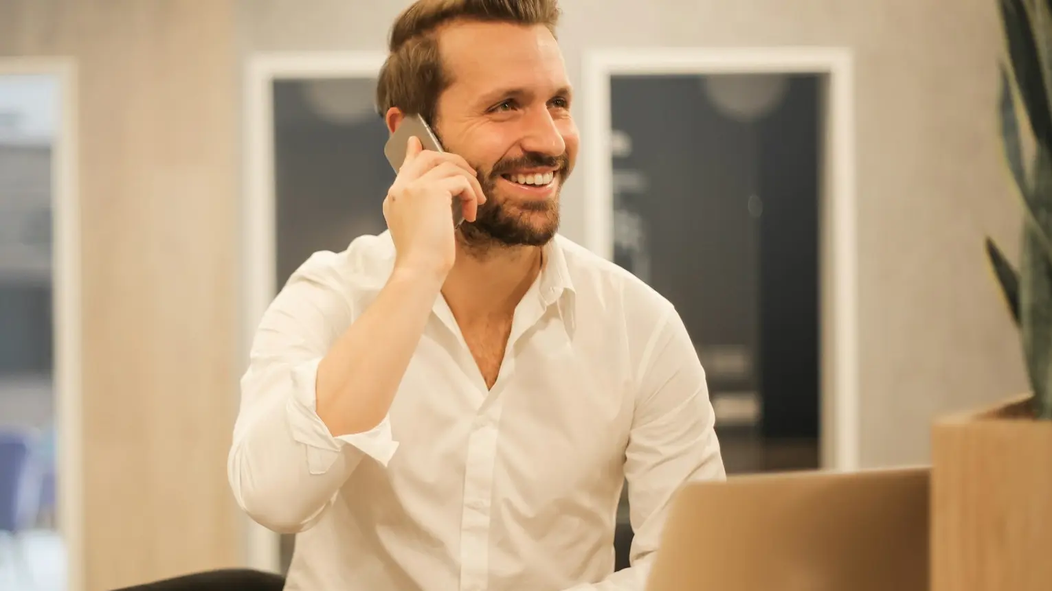 man using smartphone on chair